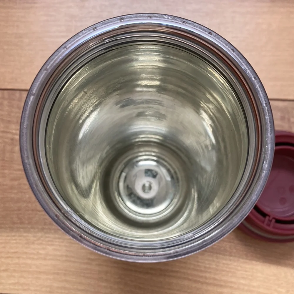 Starbucks khaki and earth tone tumbler thermos.